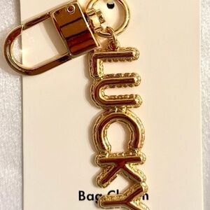 Kate Spade “Lucky” Gold Bag Charm